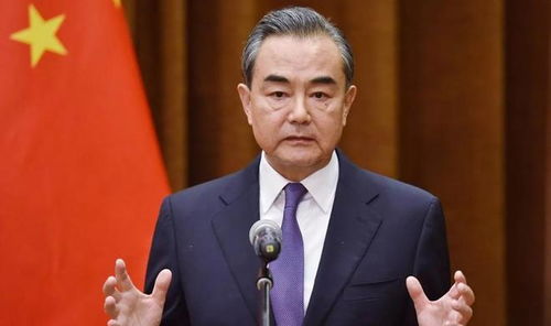 王毅签署国际调解院公约，李家超握手见证重要时刻